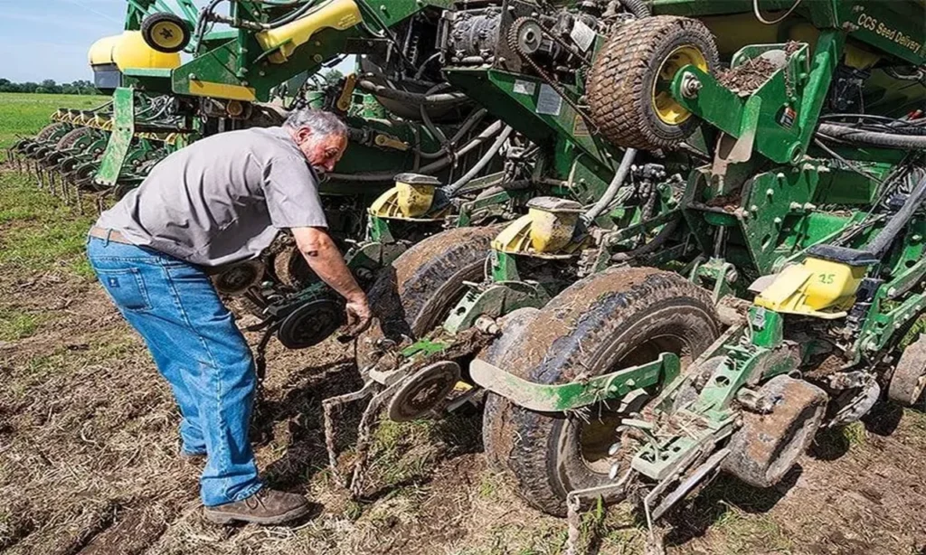 Farm vehicle insurance protecting tractors, trucks, trailers, and agricultural equipment on a modern farm.